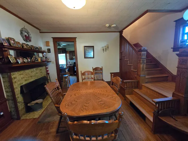 a view of a livingroom with furniture and a fireplace