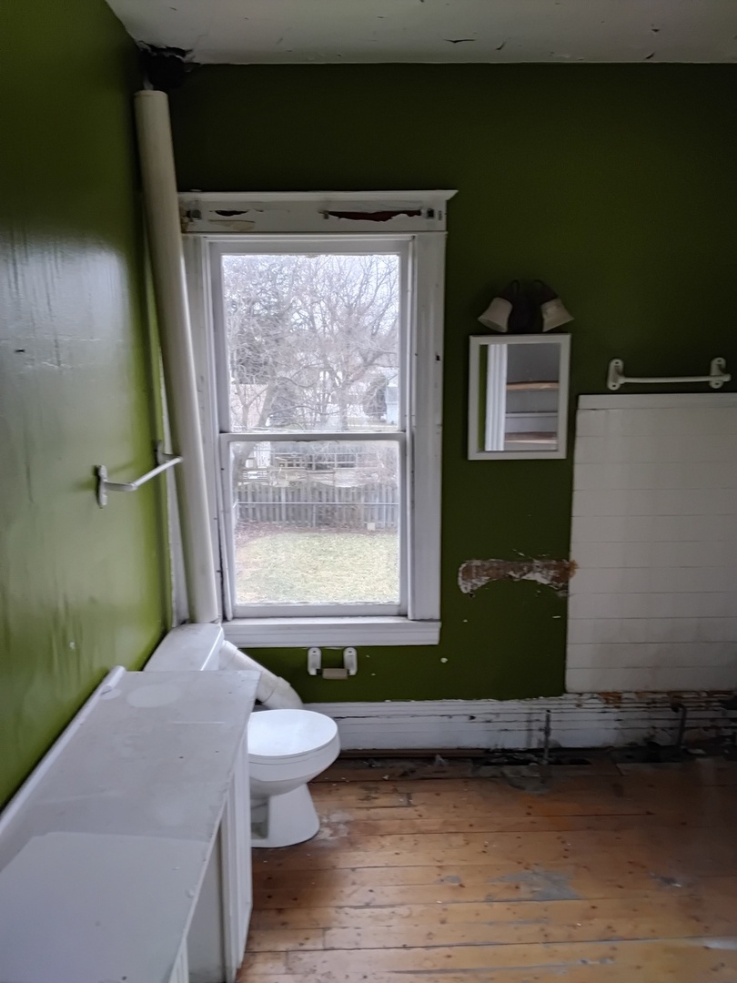 3704 214th Place Matteson, IL 60443 - Photo 29 of 29 a bathroom with a toilet a sink and a window