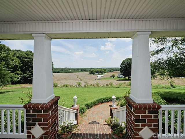 611 East Sandy Ridge Road Monroe, NC 28112 - Photo 2 of 16 a view of a patio with lawn chairs floor to ceiling window and yard
