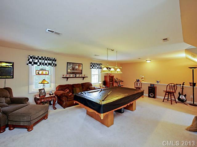 611 East Sandy Ridge Road Monroe, NC 28112 - Photo 13 of 16 a living room with furniture pool table and a window
