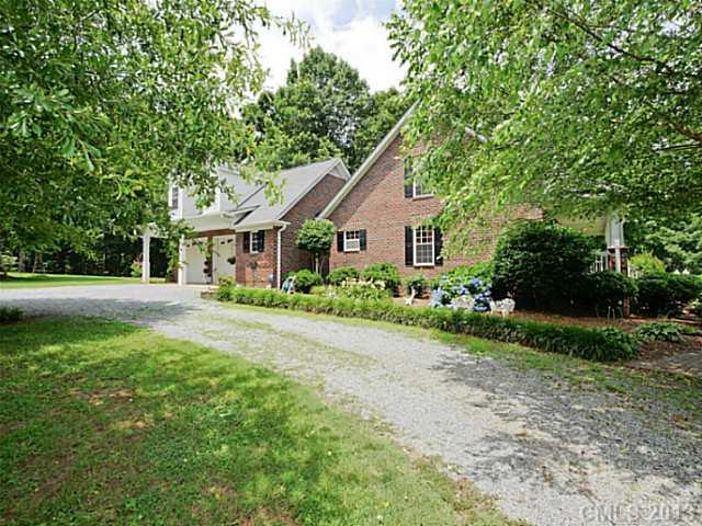 611 East Sandy Ridge Road Monroe, NC 28112 - Photo 15 of 16 a front view of a house with garden
