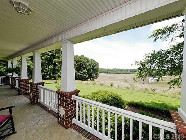 611 East Sandy Ridge Road Monroe, NC 28112 - Photo 16 of 16 a view of a porch with furniture and garden