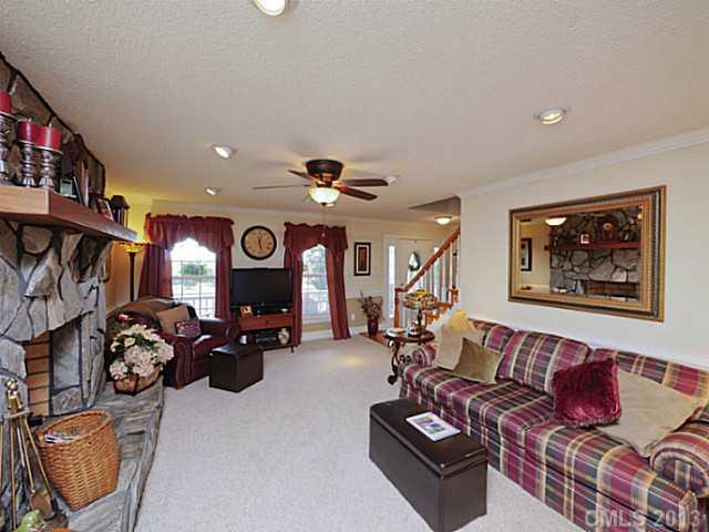 611 East Sandy Ridge Road Monroe, NC 28112 - Photo 4 of 16 a living room with furniture and a fireplace