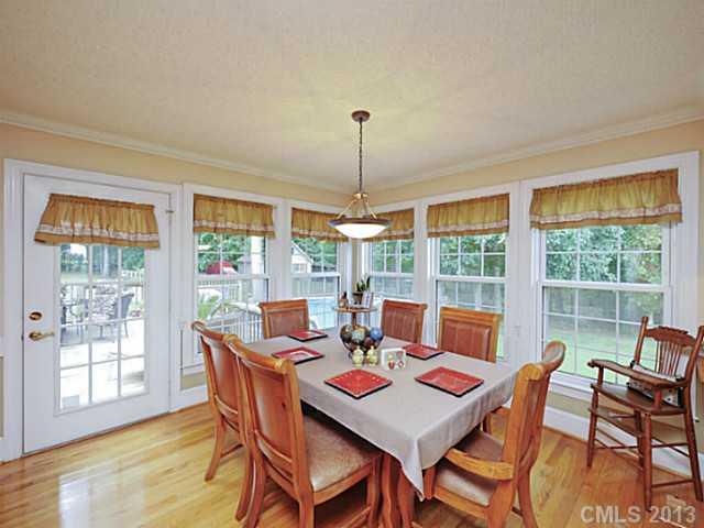 611 East Sandy Ridge Road Monroe, NC 28112 - Photo 5 of 16 a dining room with furniture window and wooden floor