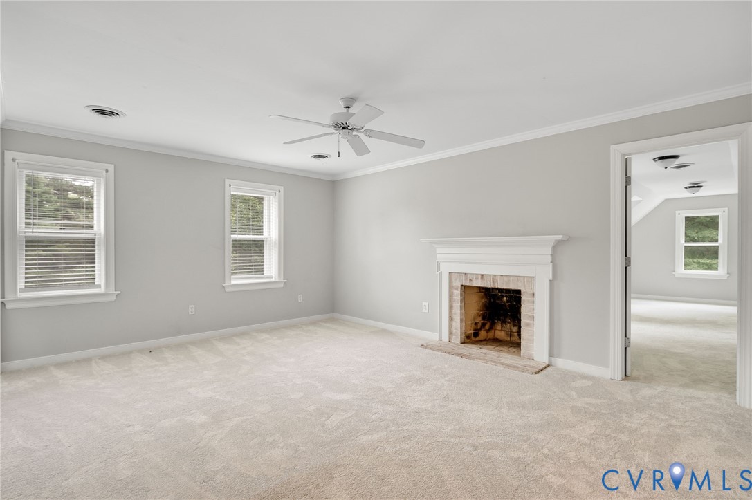 10841 Ramshorn Road Midlothian, VA 23113 - Photo 29 of 43 an empty room with windows and fireplace