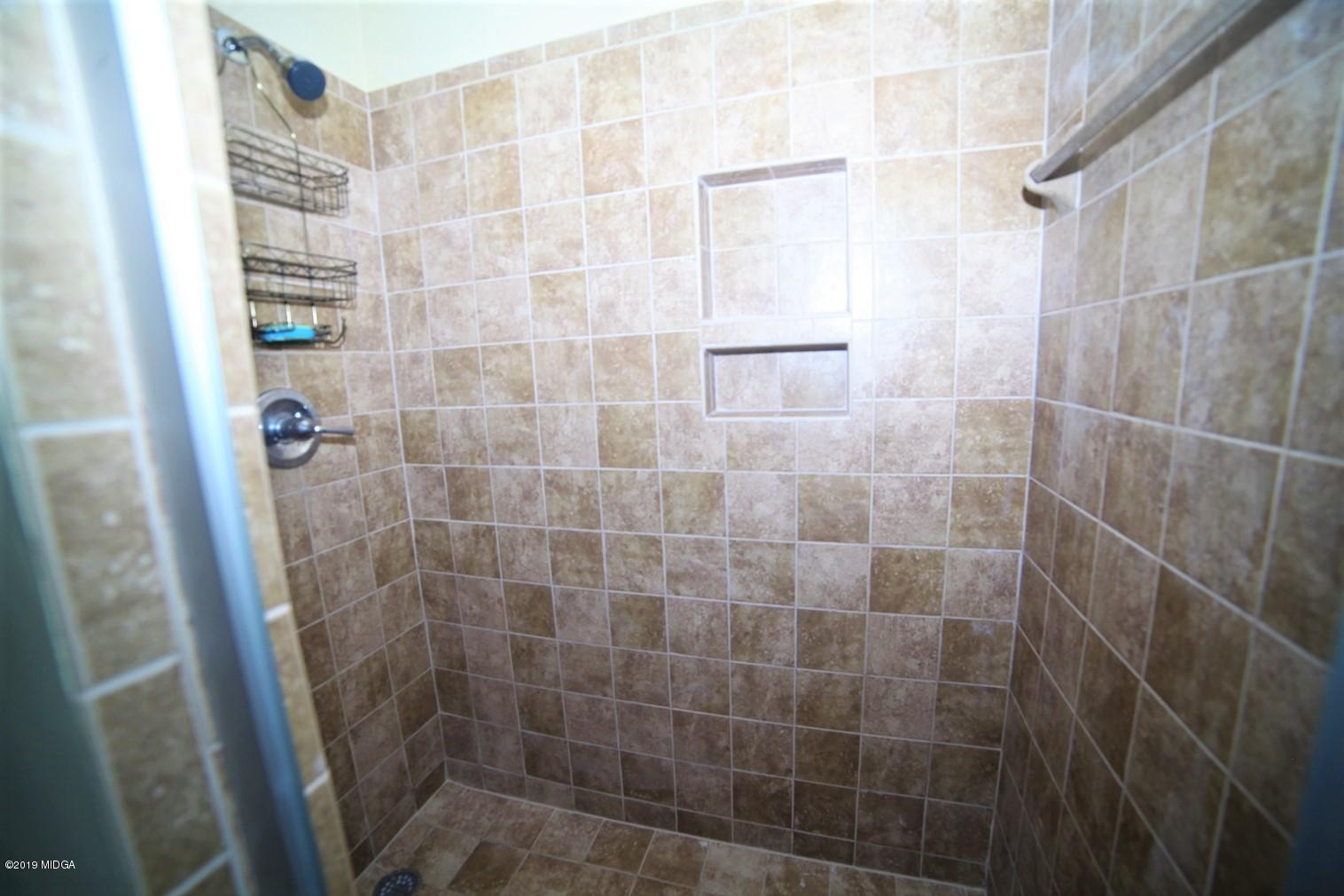 6898 Columbus Road Lizella, GA 31052 - Photo 14 of 22 a bathroom with a shower
