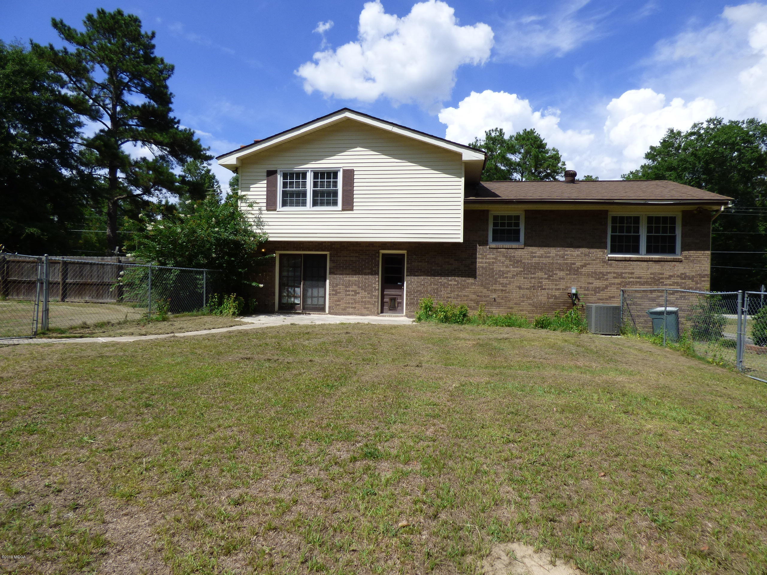 6898 Columbus Road Lizella, GA 31052 - Photo 22 of 22 a front view of a house with garden