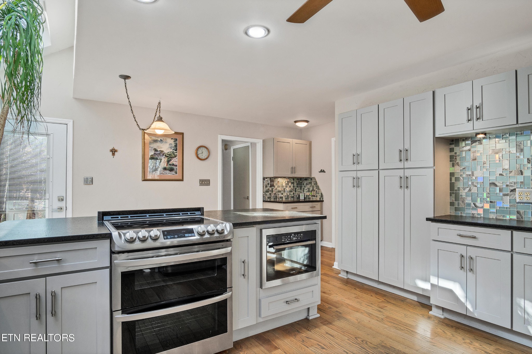 105 Clayton Way Oak Ridge, TN 37830 - Photo 11 of 42 a kitchen with cabinets and wooden floor