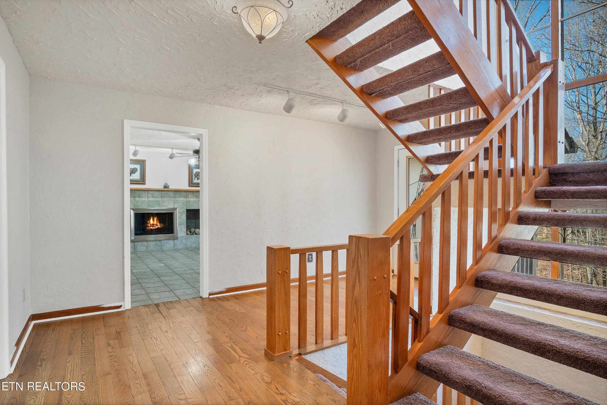 105 Clayton Way Oak Ridge, TN 37830 - Photo 20 of 42 a view of staircase with wooden floor and a rug