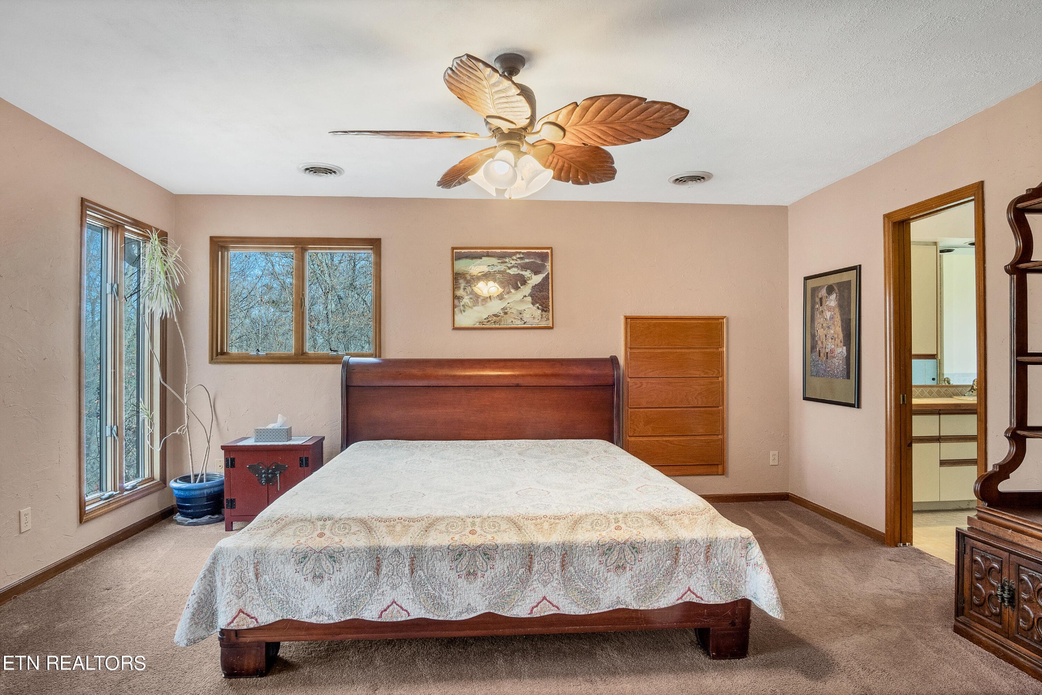105 Clayton Way Oak Ridge, TN 37830 - Photo 21 of 42 a bedroom with a bed and wooden floor