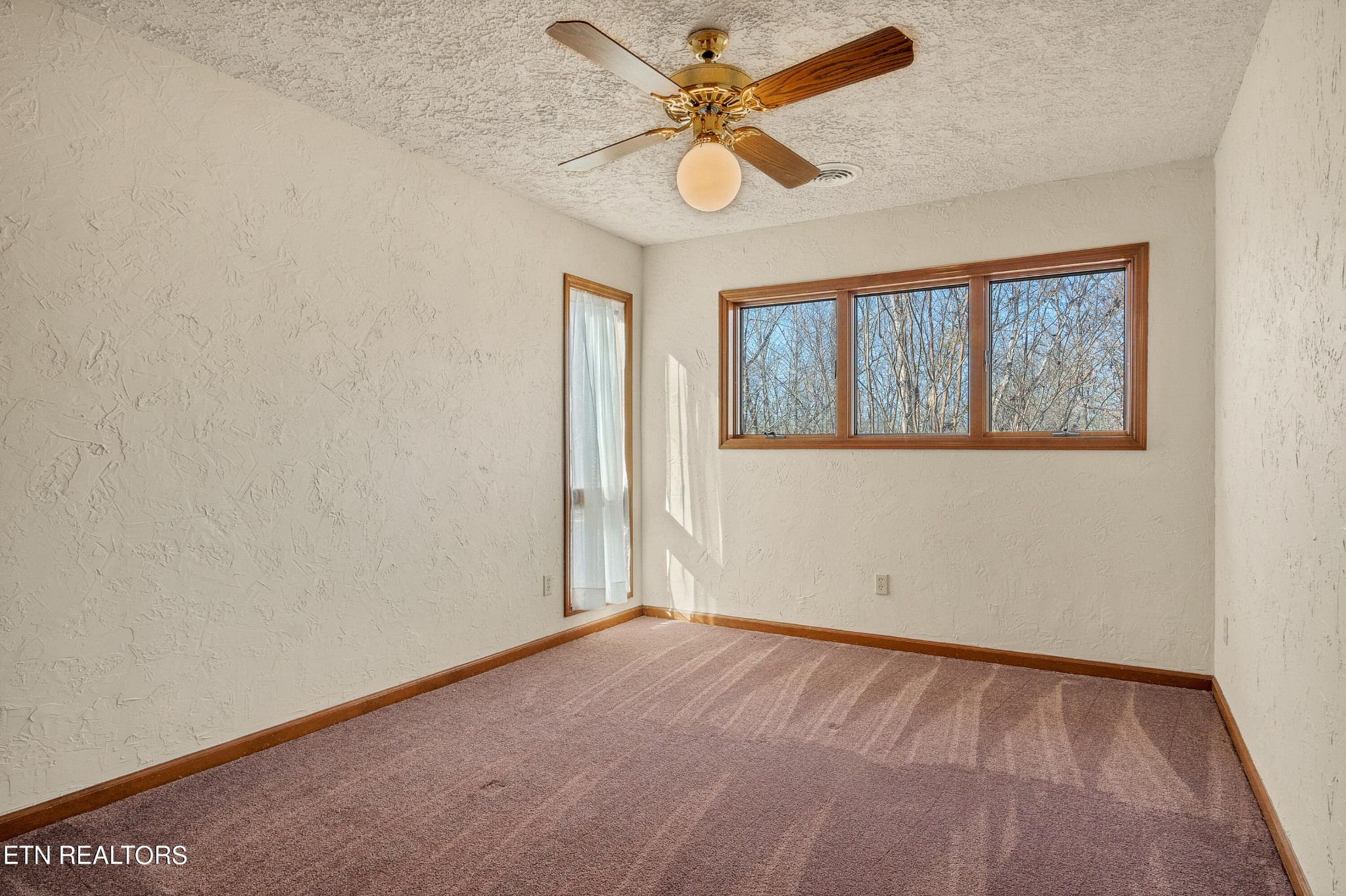 105 Clayton Way Oak Ridge, TN 37830 - Photo 30 of 42 an empty room with a window and a fan