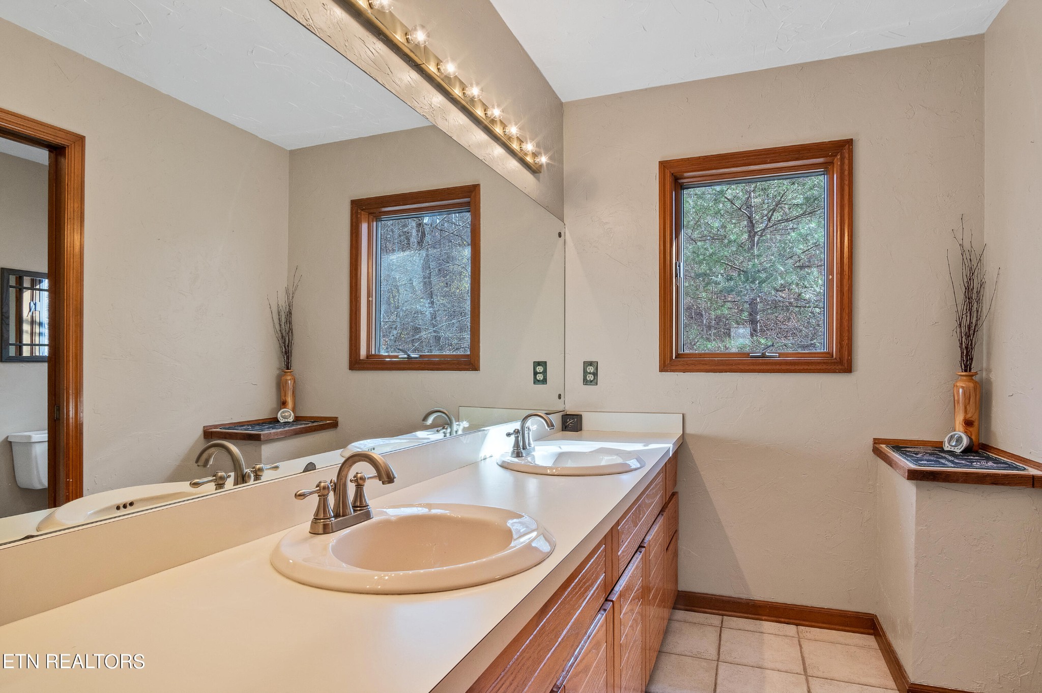 105 Clayton Way Oak Ridge, TN 37830 - Photo 32 of 42 a bathroom with a double vanity sink and a mirror