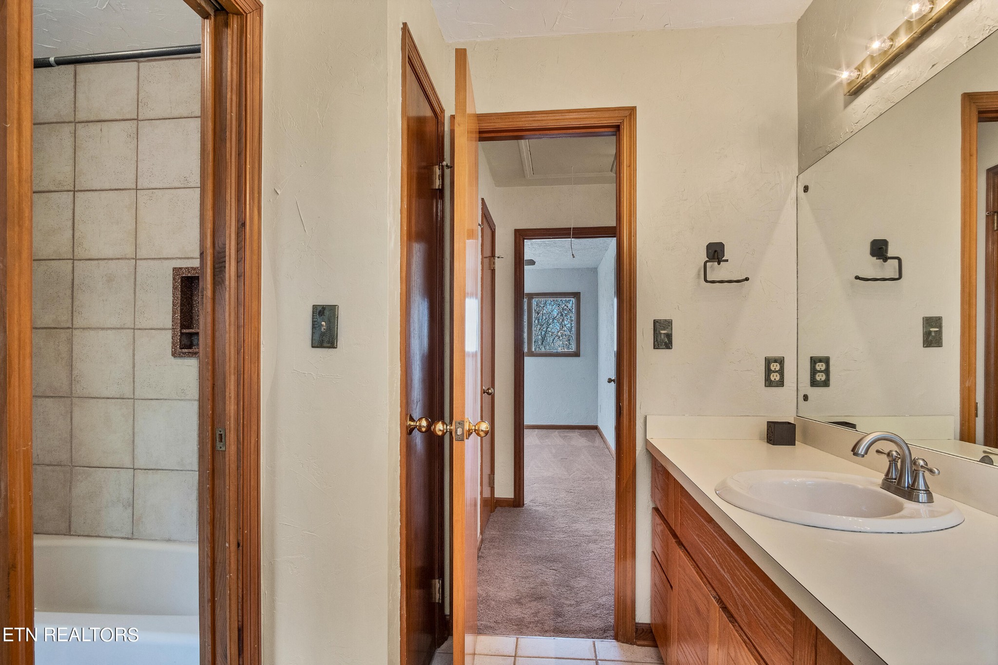 105 Clayton Way Oak Ridge, TN 37830 - Photo 33 of 42 a bathroom with a sink and a mirror