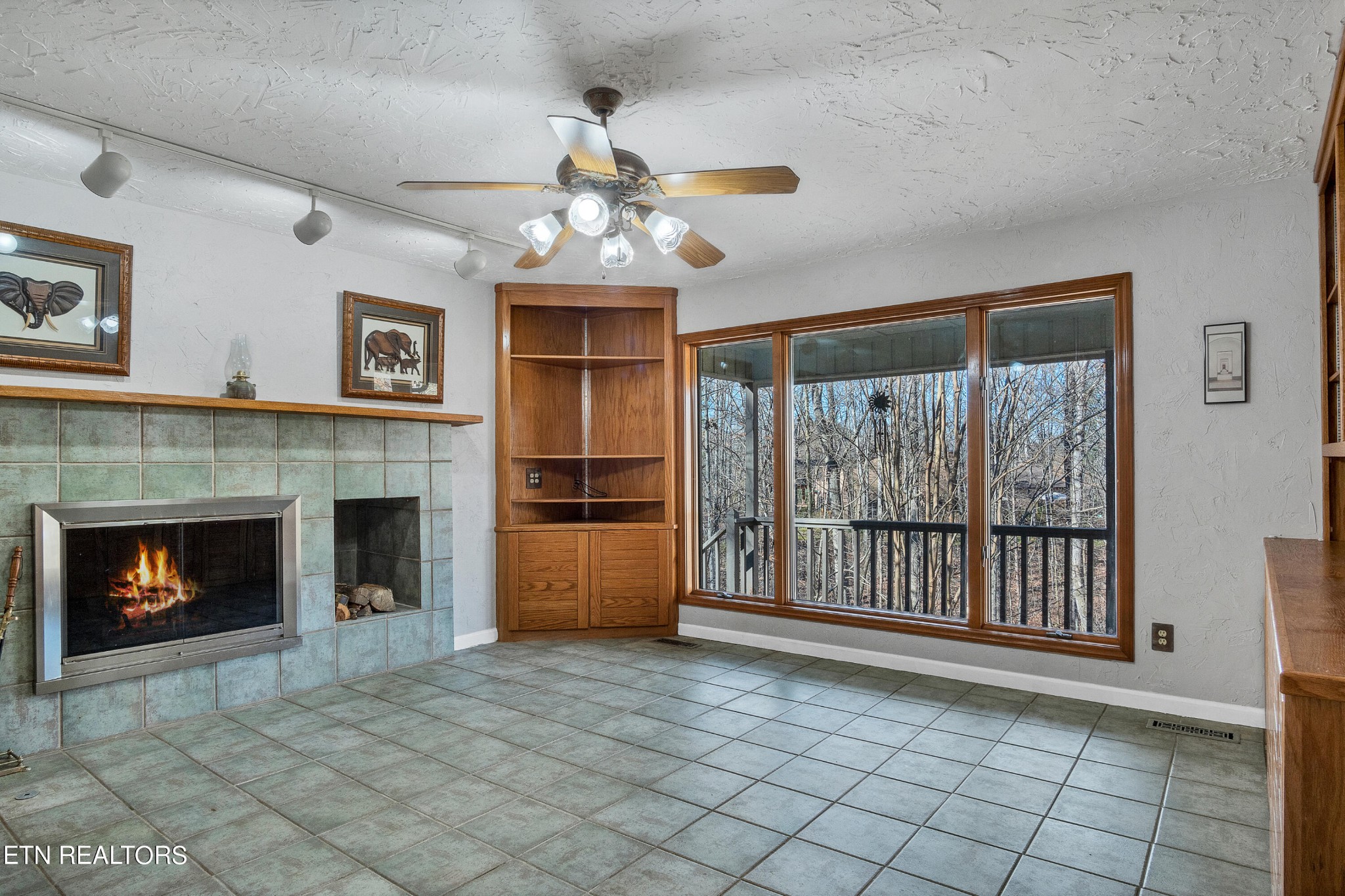 105 Clayton Way Oak Ridge, TN 37830 - Photo 5 of 42 a view of an empty room with a fireplace and a window