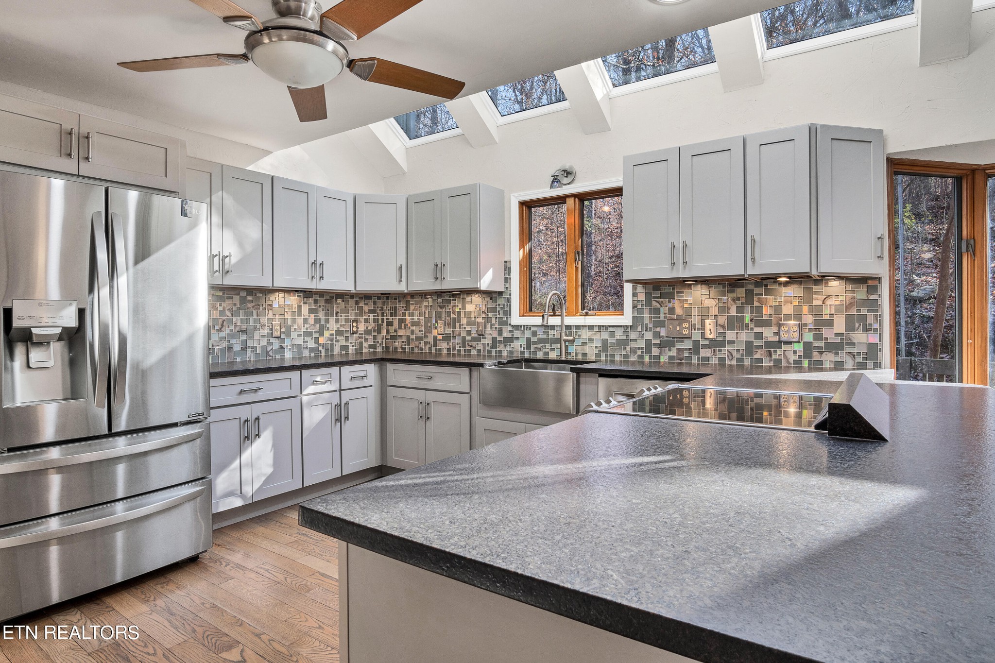 105 Clayton Way Oak Ridge, TN 37830 - Photo 8 of 42 a kitchen with stainless steel appliances granite countertop a sink refrigerator and cabinets