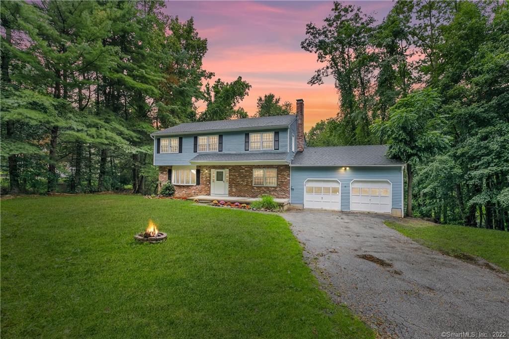 6 Jacklin Road Bethel, CT 06801 - Photo 1 of 1 a front view of a house with garden