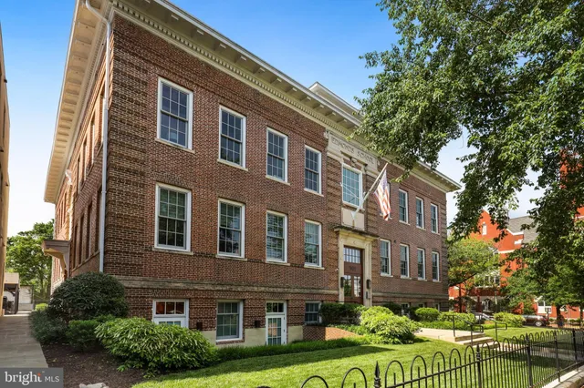 a front view of a building with garden