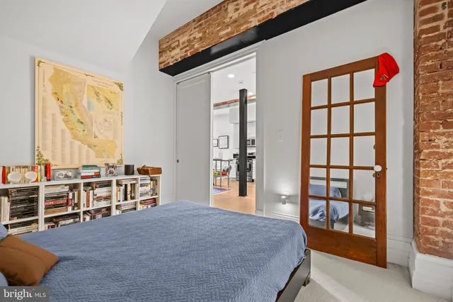 a bedroom with furniture and window