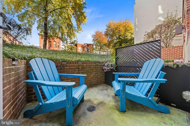 a view of a chairs and table in the patio