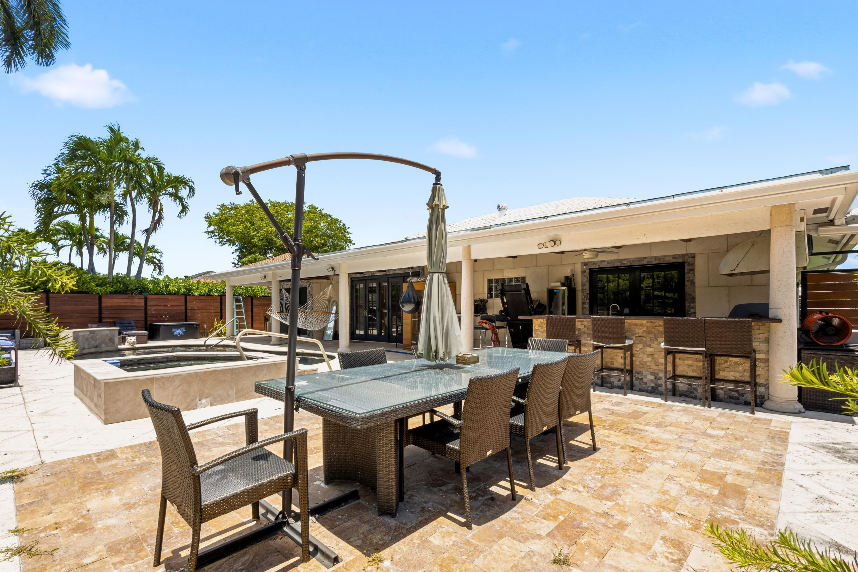 5223 Deerhurst Crescent Circle Boca Raton, FL 33486 - Photo 48 of 51 a view of a dinning table and chairs in the patio