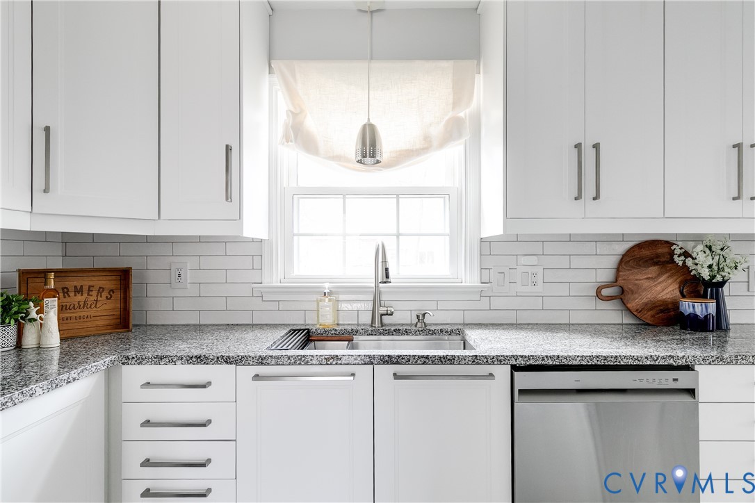 900 Ryder Road North Chesterfield, VA 23235 - Photo 12 of 45 a kitchen with granite countertop white cabinets and a sink