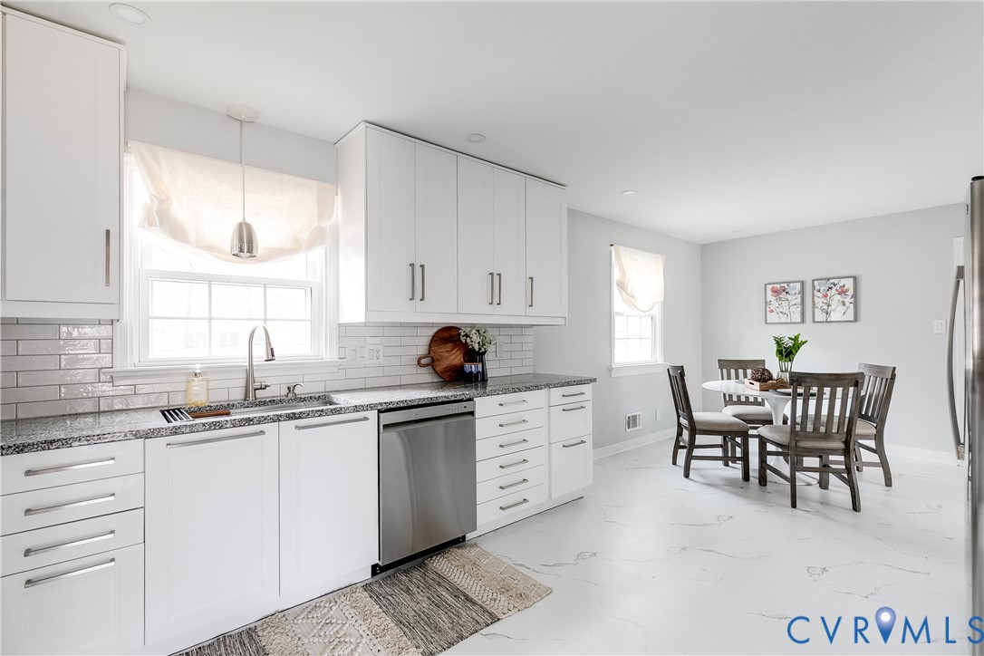 900 Ryder Road North Chesterfield, VA 23235 - Photo 13 of 45 a kitchen that has a sink and chair in it