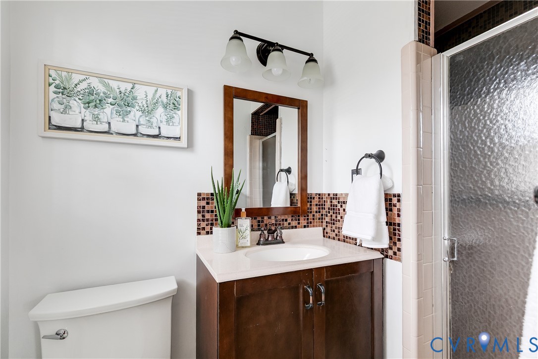 900 Ryder Road North Chesterfield, VA 23235 - Photo 28 of 45 a bathroom with a sink and a mirror