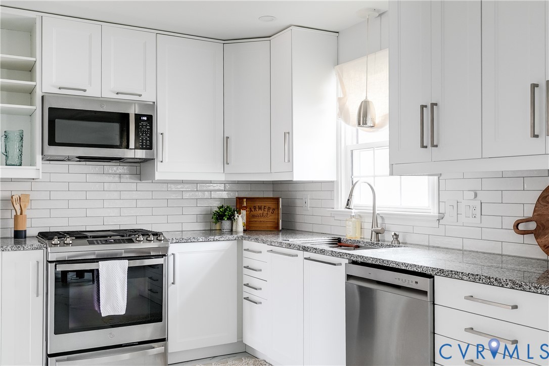 900 Ryder Road North Chesterfield, VA 23235 - Photo 8 of 45 a kitchen with granite countertop white cabinets and stainless steel appliances