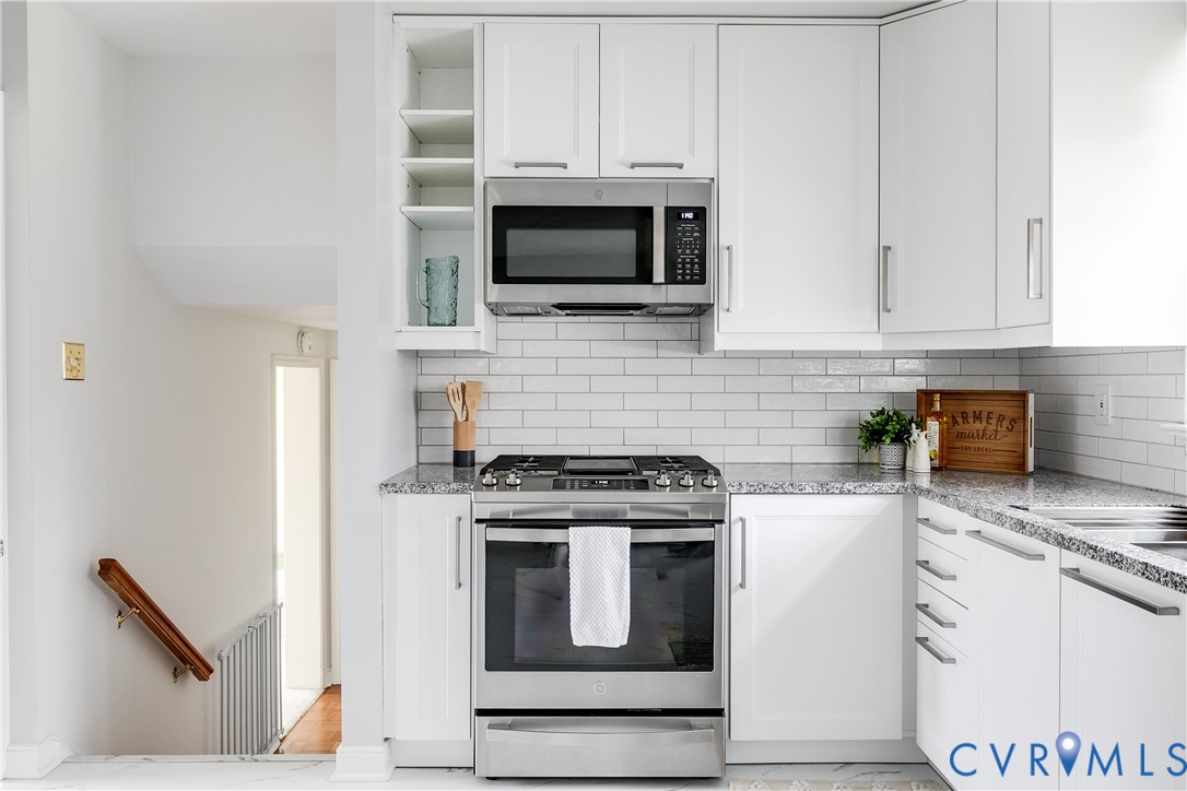 900 Ryder Road North Chesterfield, VA 23235 - Photo 10 of 45 a kitchen with stainless steel appliances granite countertop a stove and a microwave