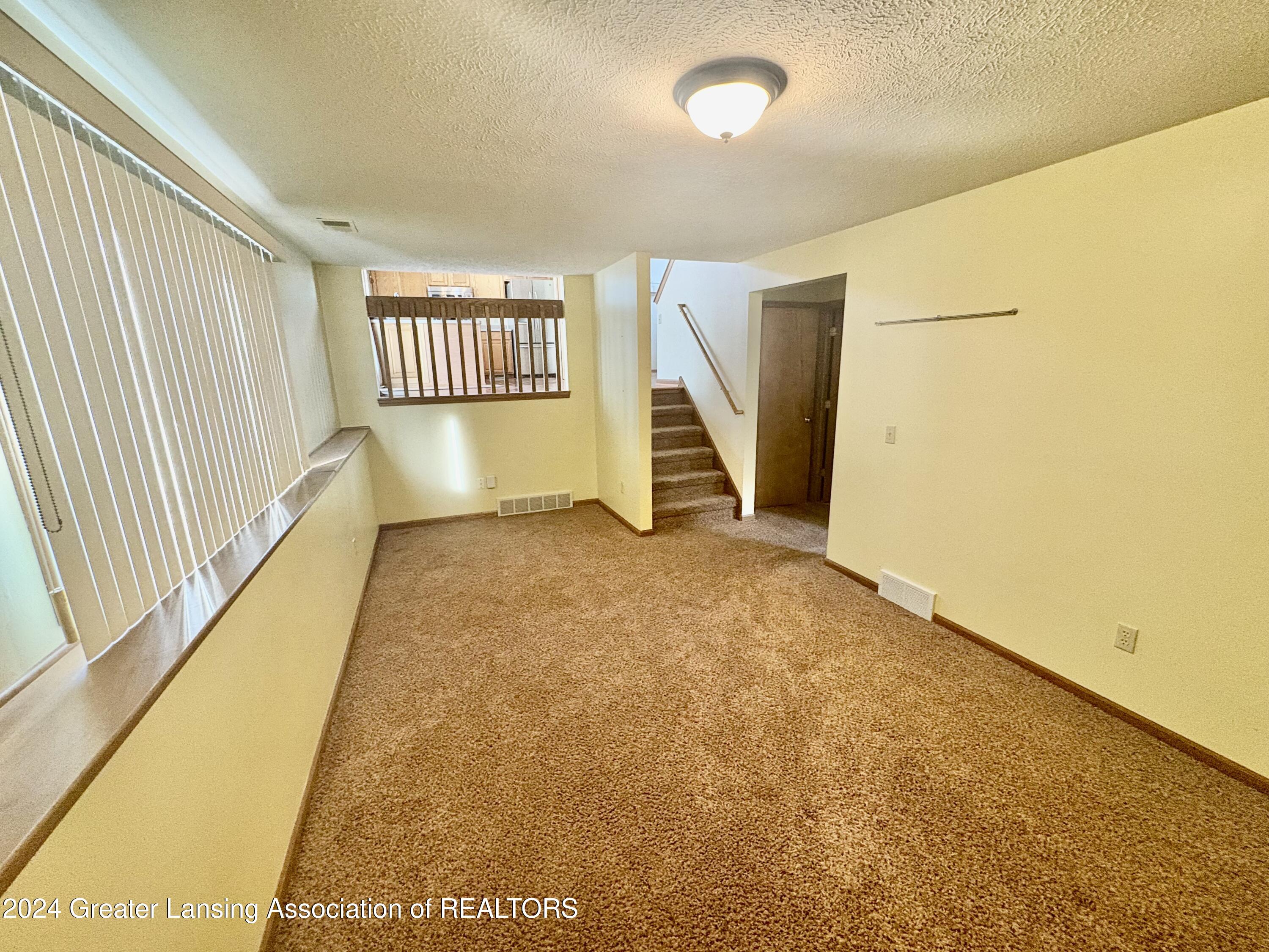 13872 Mead Creek Road Bath, MI 48808 - Photo 17 of 32 Family Room