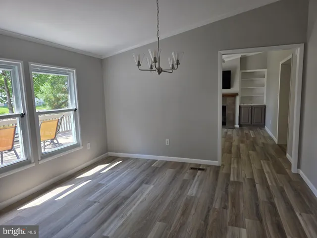 a fireplace with a hallway