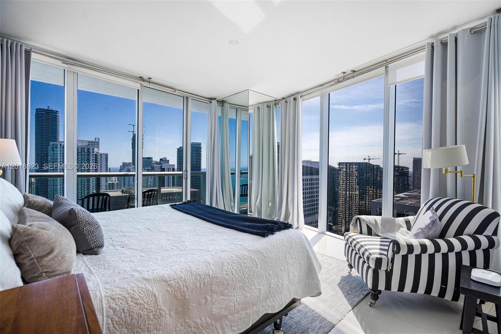 495 Brickell Avenue, Unit 4911 Miami, FL 33131 - Photo 19 of 35 a bedroom with a bed and a large window
