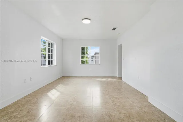 an empty room with windows