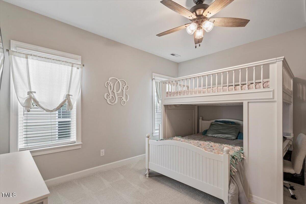 357 Marshcroft Way Rolesville, NC 27571 - Photo 24 of 41 a bedroom with a bed and a window
