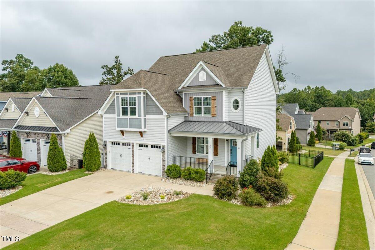 357 Marshcroft Way Rolesville, NC 27571 - Photo 3 of 41 a front view of a house with a yard