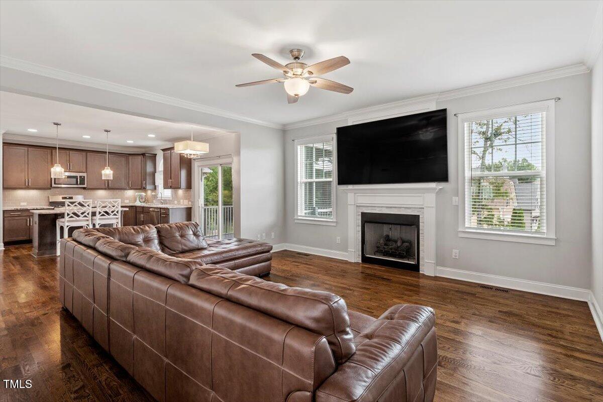 357 Marshcroft Way Rolesville, NC 27571 - Photo 8 of 41 a living room with furniture fireplace and flat screen tv