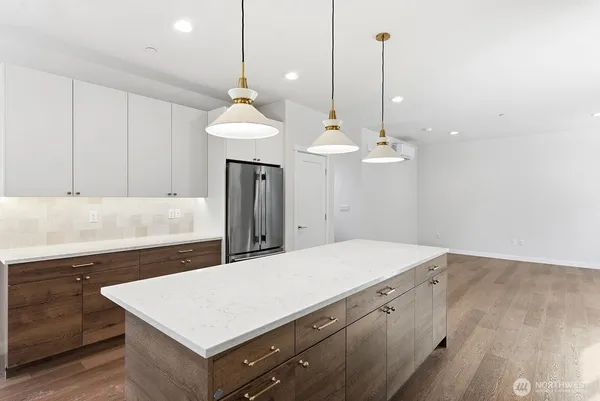 a kitchen with a table a sink and dishwasher