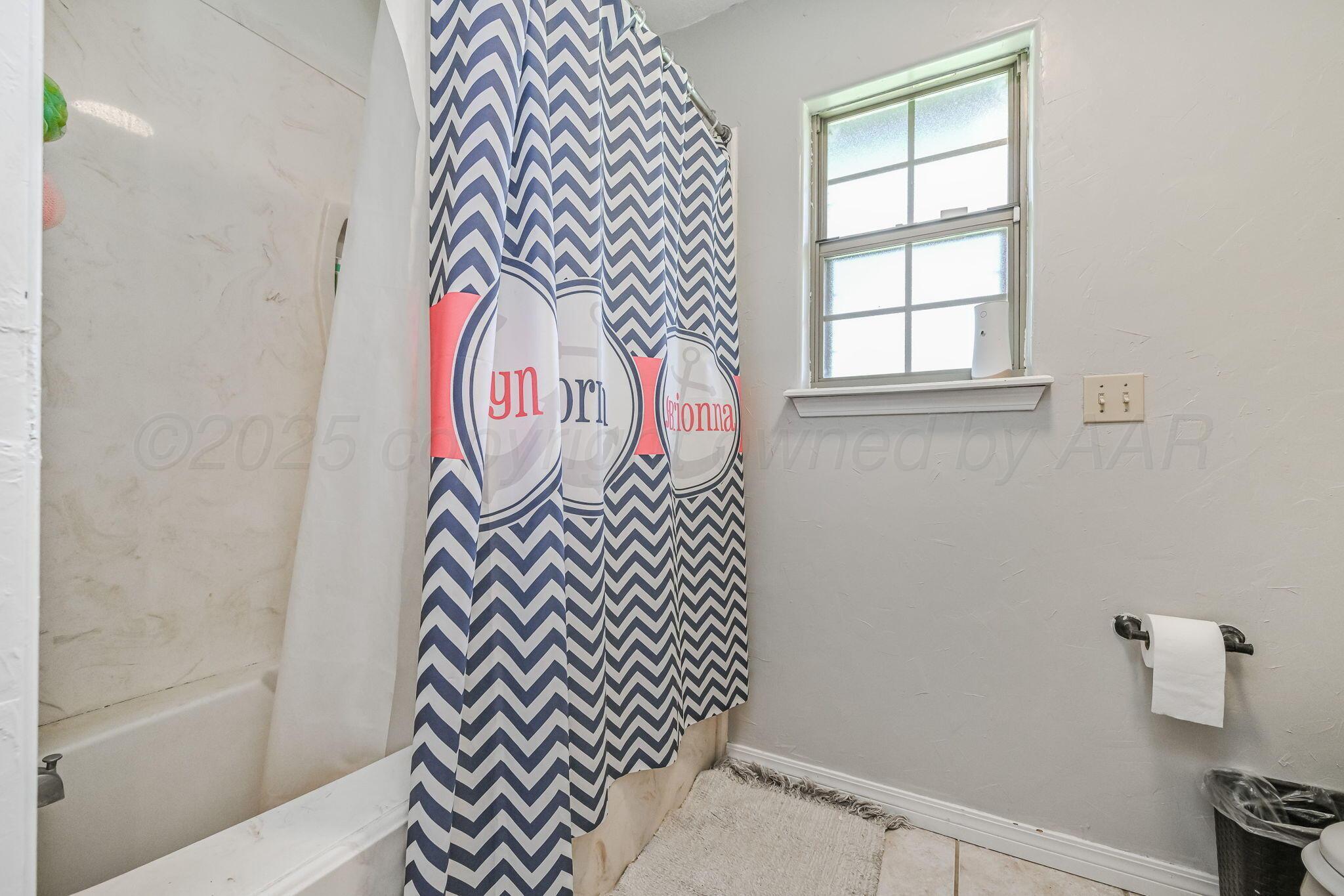 9151 Helium Road Amarillo, TX 79119 - Photo 15 of 49 a bathroom with a sink and a shower