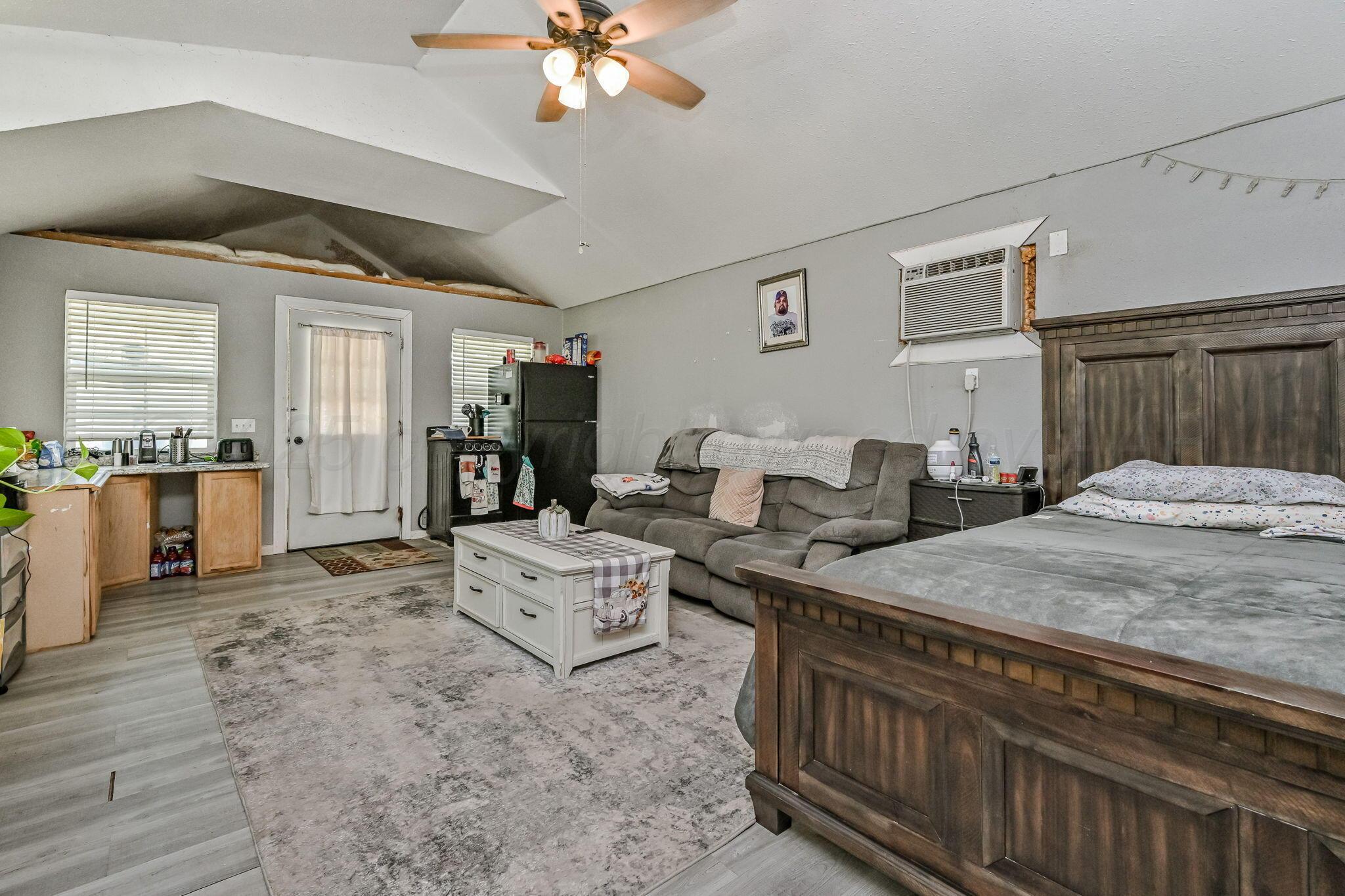 9151 Helium Road Amarillo, TX 79119 - Photo 21 of 49 a living room with furniture and a chandelier