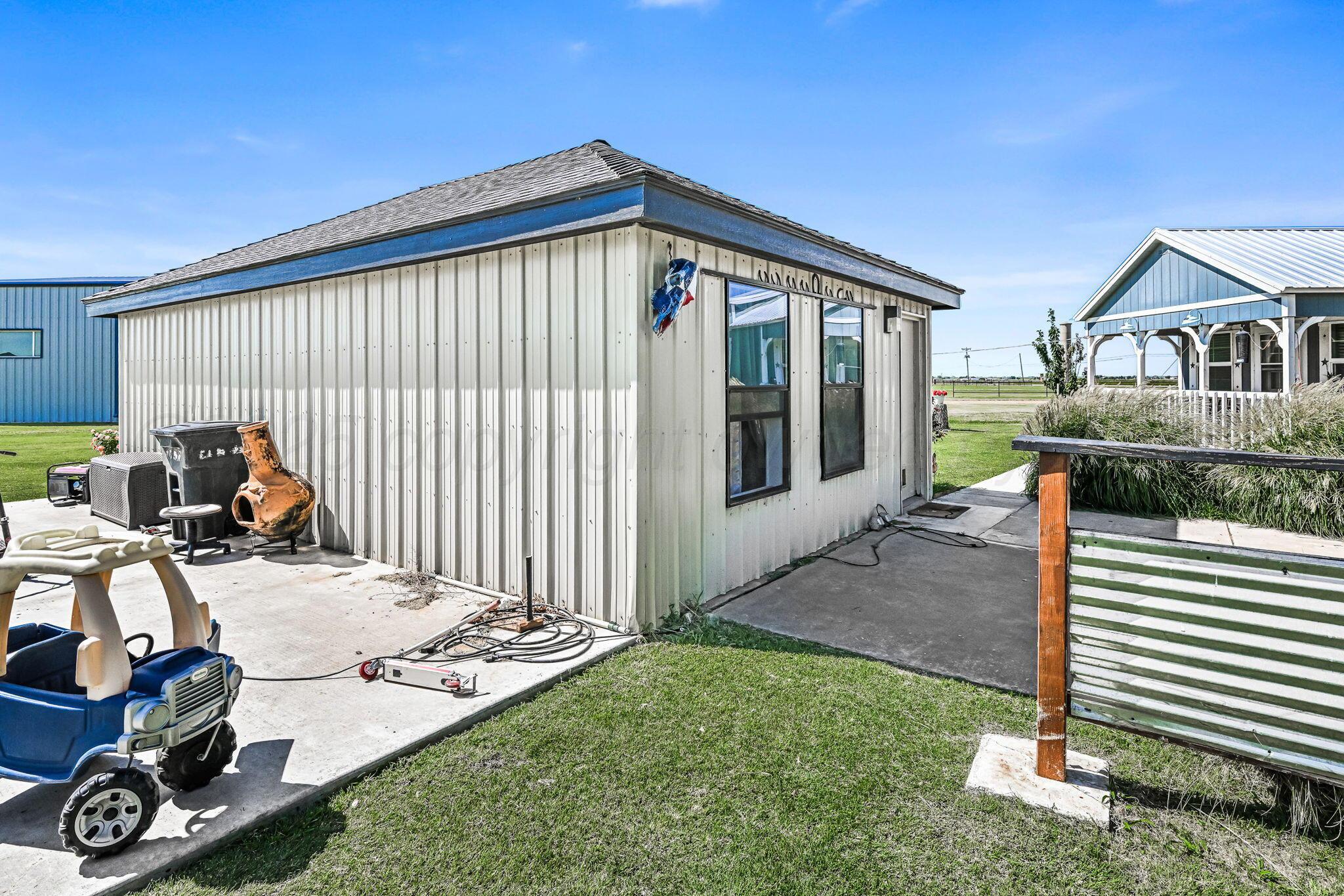 9151 Helium Road Amarillo, TX 79119 - Photo 24 of 49 a view of a house with backyard and porch