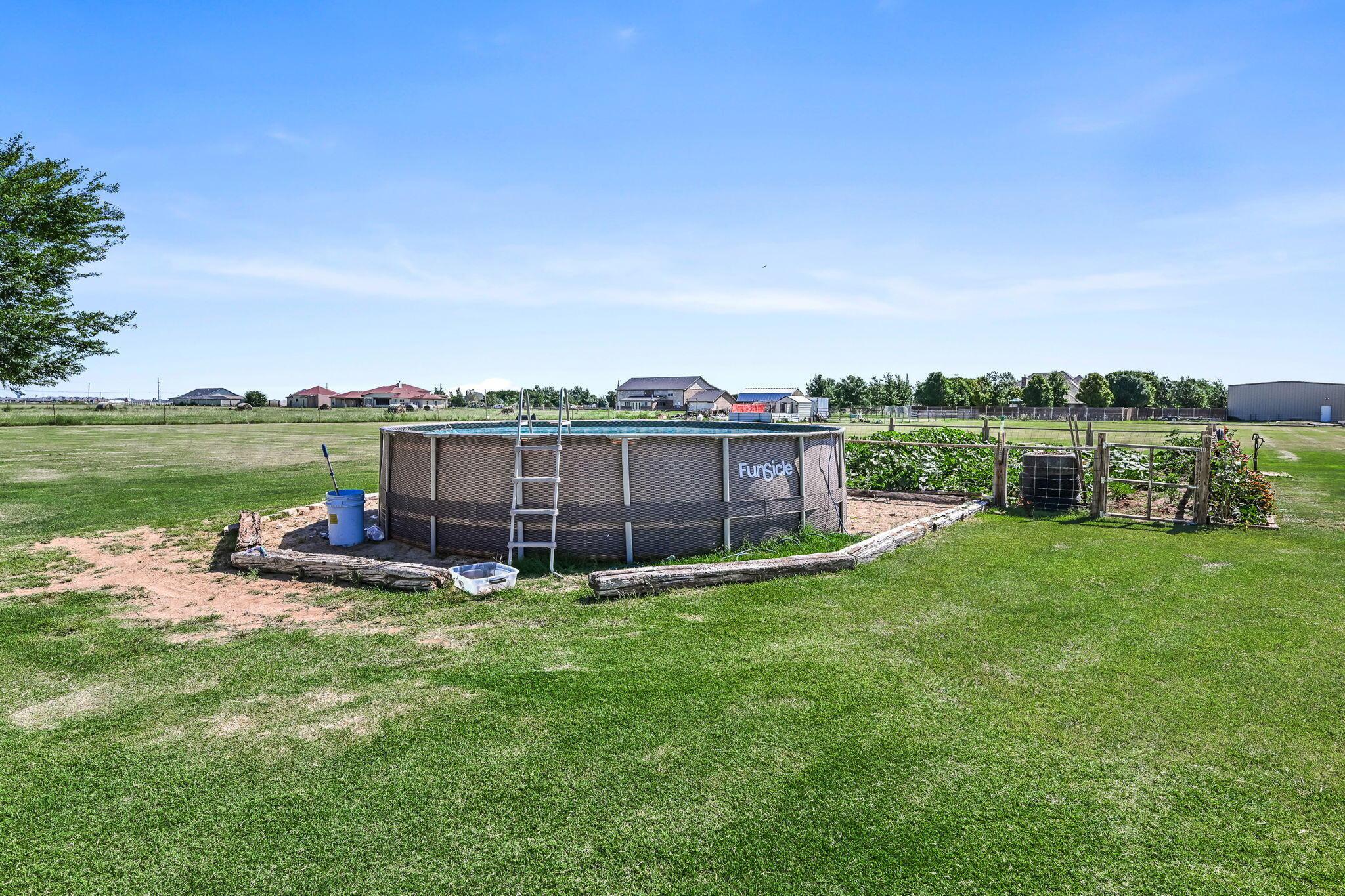 9151 Helium Road Amarillo, TX 79119 - Photo 27 of 49 a view of a chair and table in the garden
