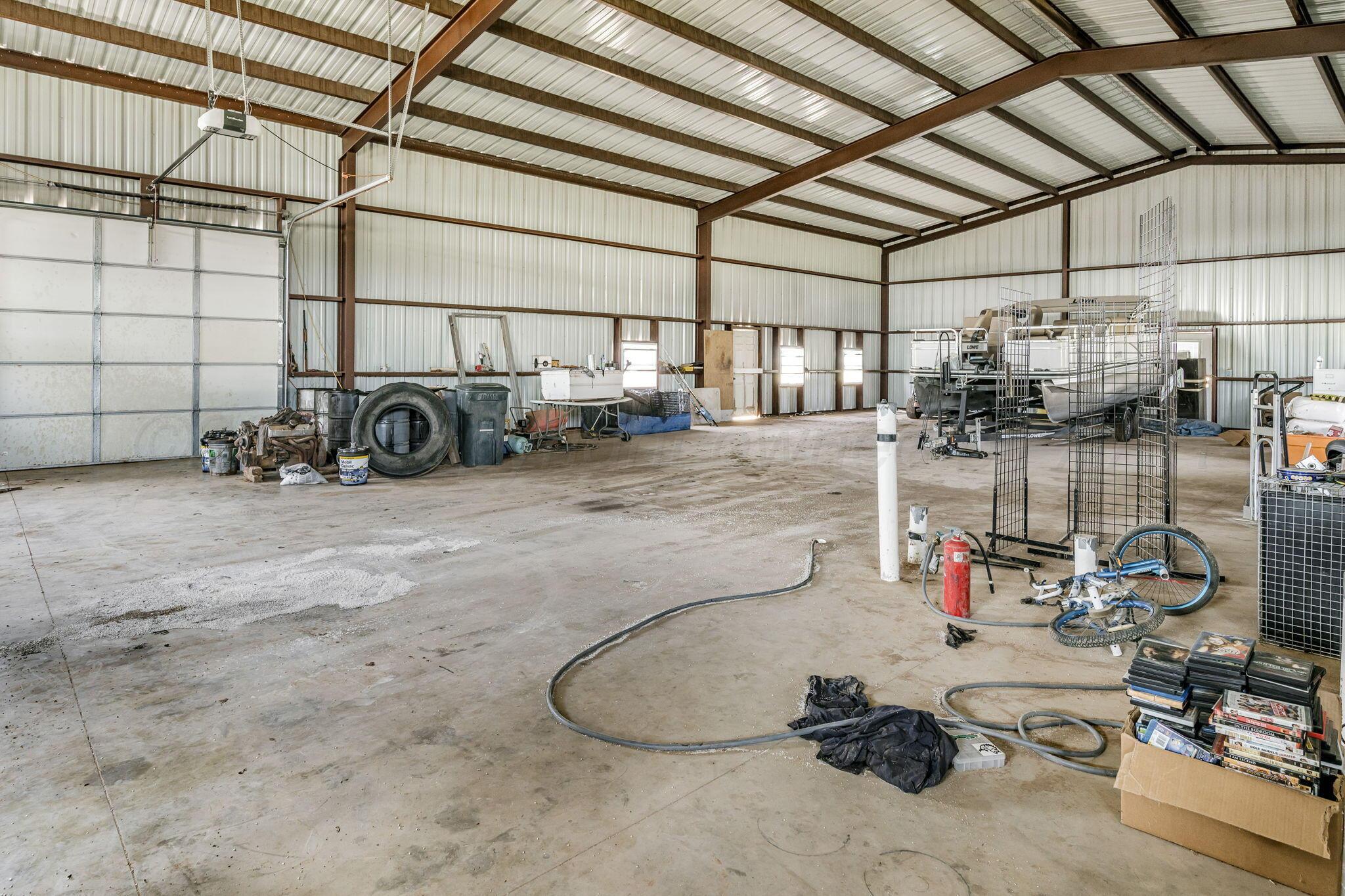9151 Helium Road Amarillo, TX 79119 - Photo 30 of 49 a room with lots of parked cars