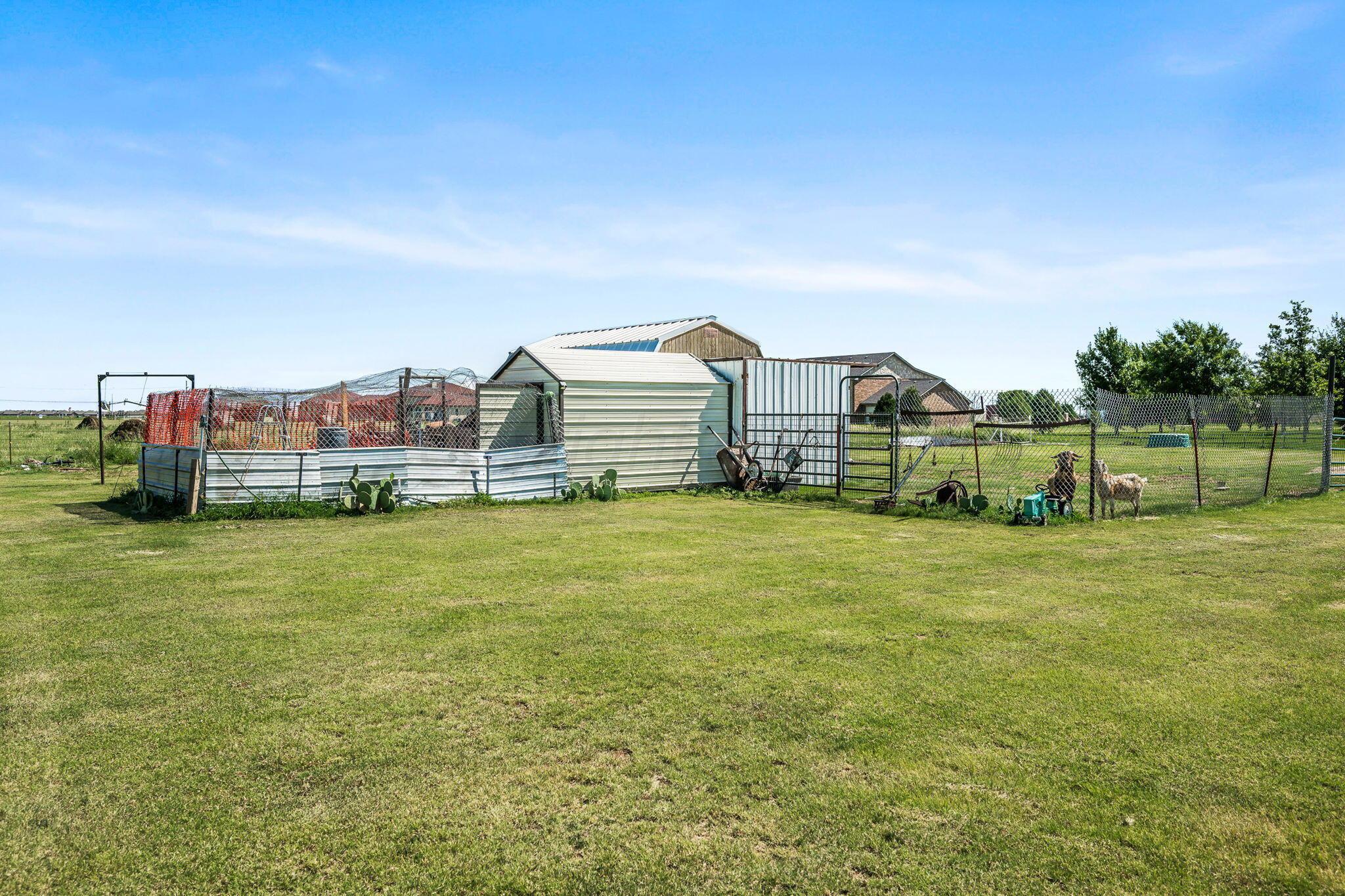 9151 Helium Road Amarillo, TX 79119 - Photo 33 of 49 a view of a large garden with plants and large trees