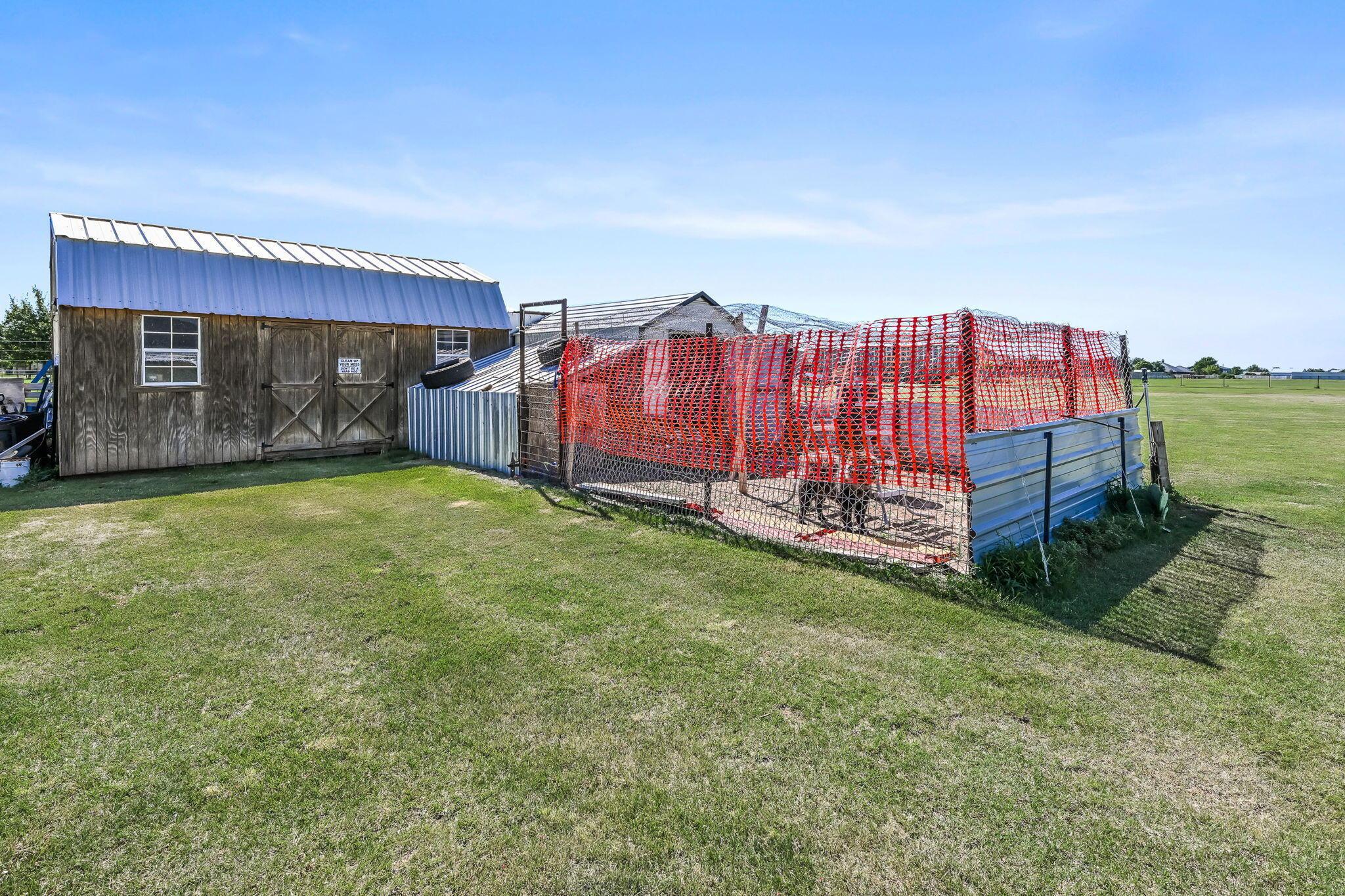 9151 Helium Road Amarillo, TX 79119 - Photo 34 of 49 a view of a backyard with a garden