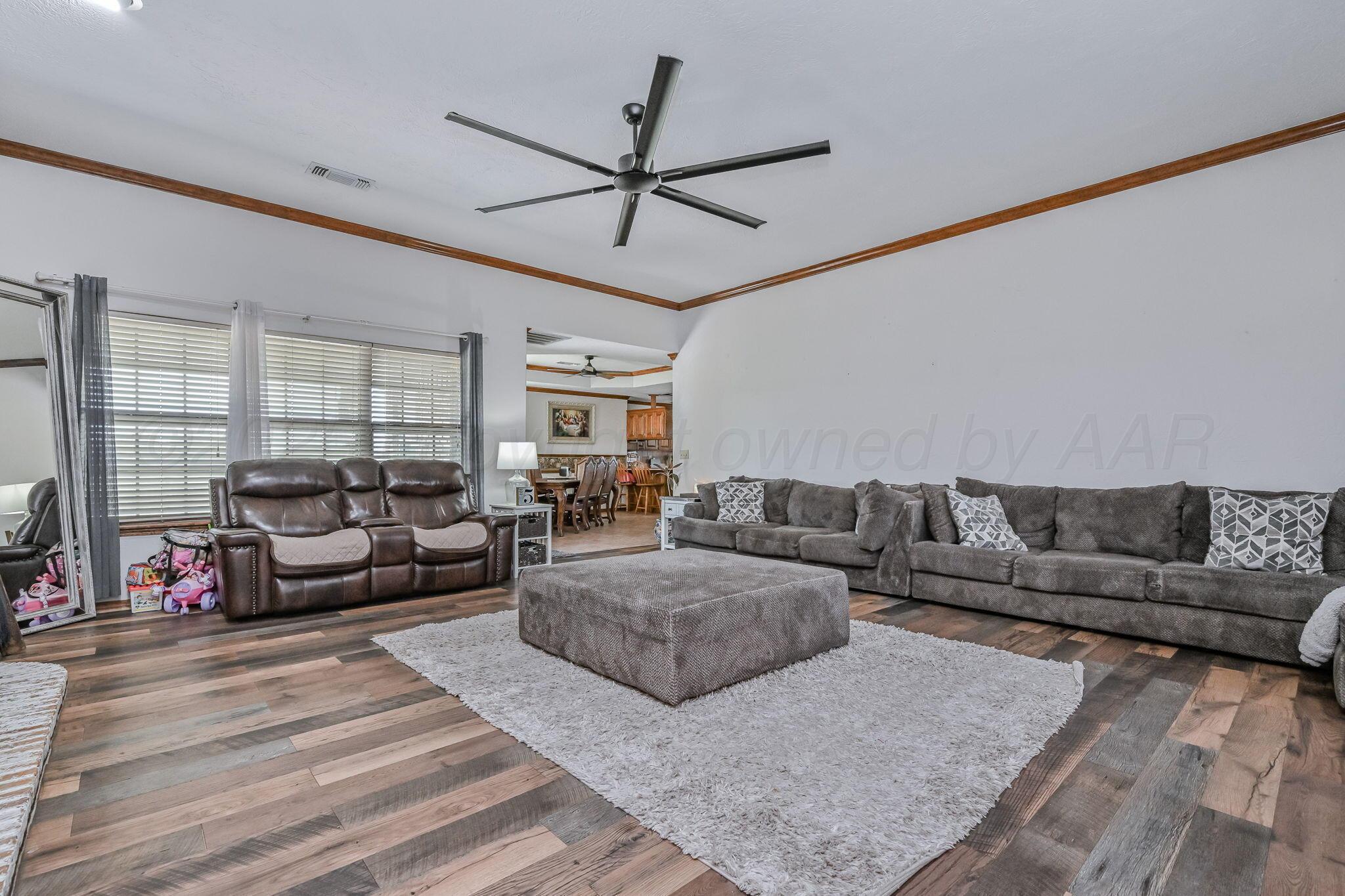 9151 Helium Road Amarillo, TX 79119 - Photo 4 of 49 a living room with furniture and a large window