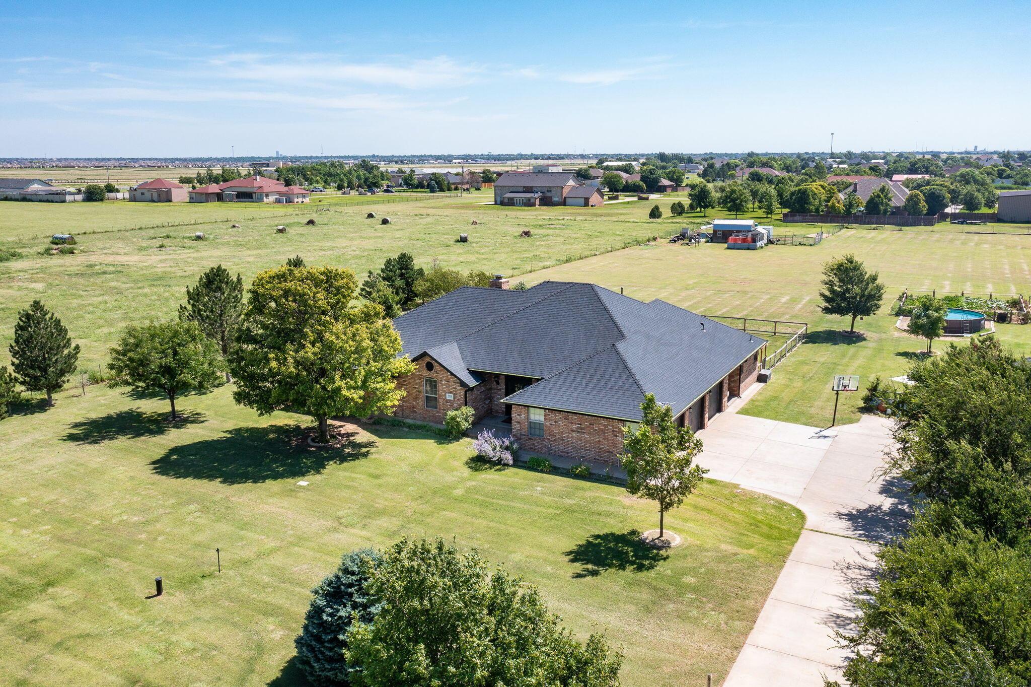 9151 Helium Road Amarillo, TX 79119 - Photo 43 of 49 a view of a lake with a yard