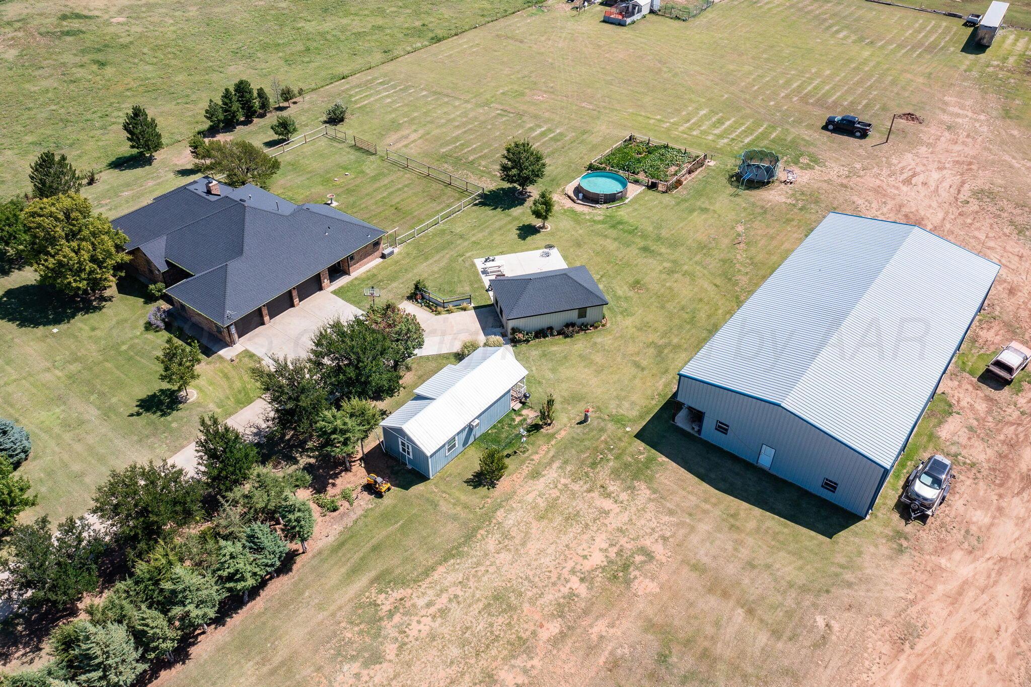 9151 Helium Road Amarillo, TX 79119 - Photo 45 of 49 an aerial view of a house with a yard
