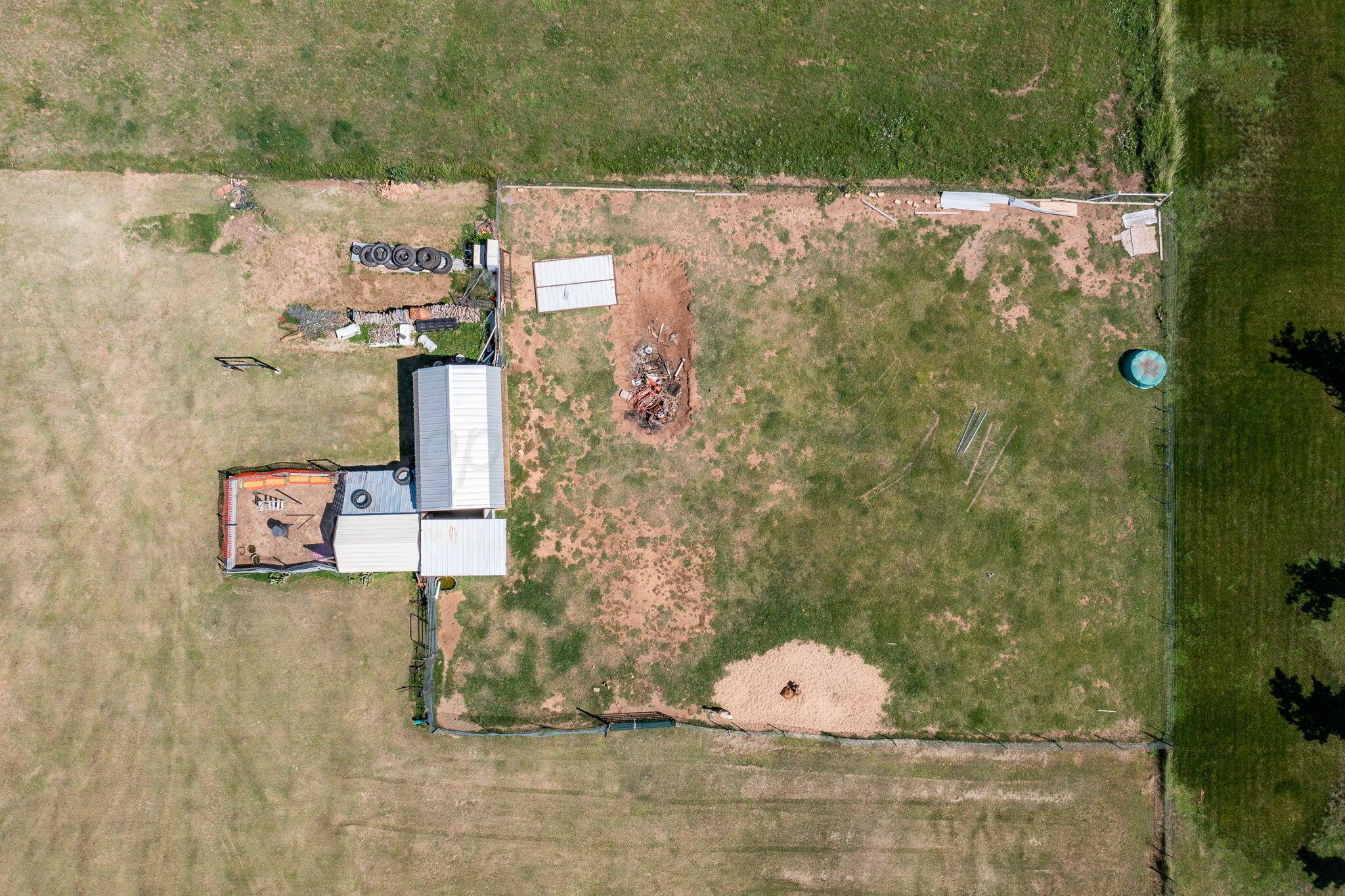 9151 Helium Road Amarillo, TX 79119 - Photo 47 of 49 an aerial view of a house with a yard and garden