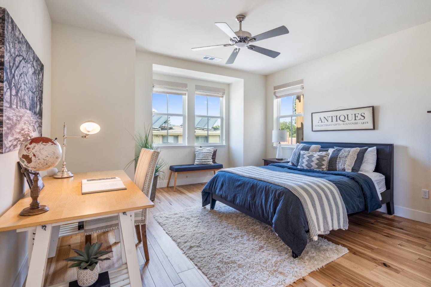 100 Tilton Avenue San Mateo, CA 94401 - Photo 13 of 23 a bedroom with a large bed a desk and chair
