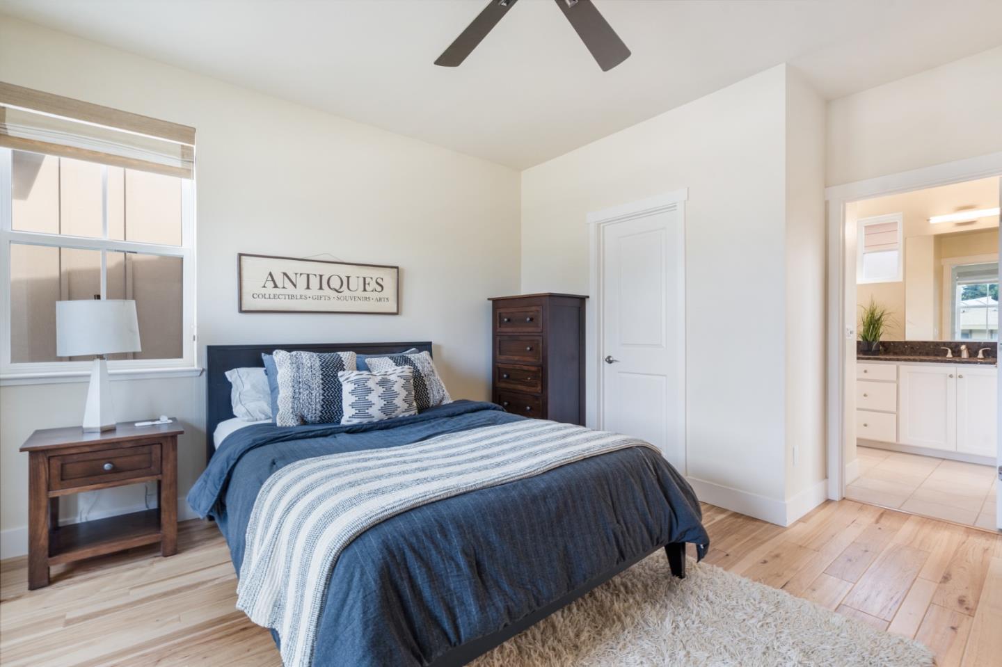 100 Tilton Avenue San Mateo, CA 94401 - Photo 15 of 23 a bedroom with a bed and a painting on the wall